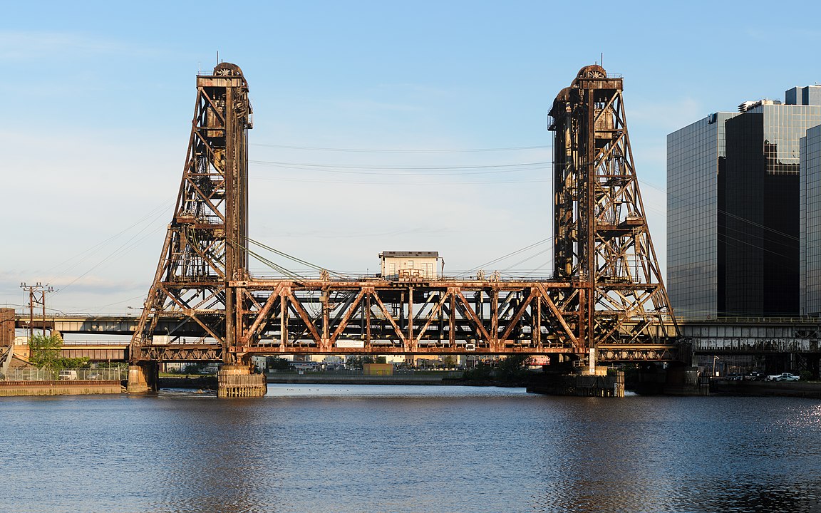 Four-segment (2 × 2) panorama of the Dock Bridge, as seen from Newark, New Jersey.