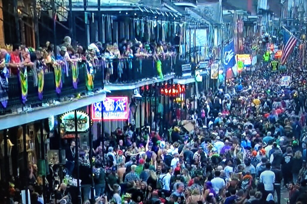 Crowded streets of New Orleans during Mardi Gras.