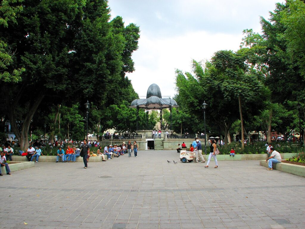 Zócalo in Oaxaca, Mexico, with people relaxing and enjoying the park