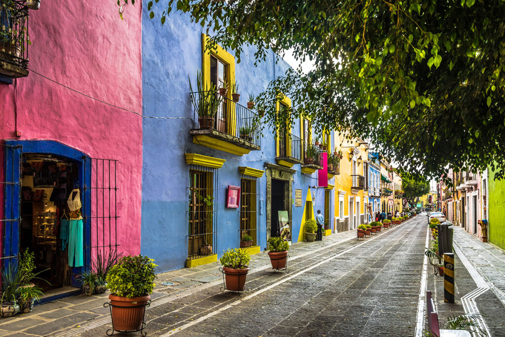 Colorful buildings lining Callejón de los Sapos in Puebla, Mexico.