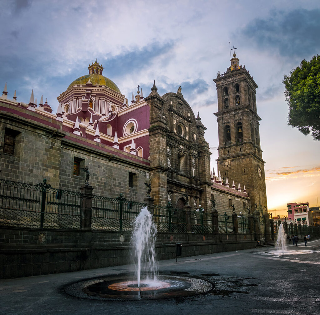 Puebla Cathedral at sunset with fountain in the foreground, Puebla, Mexico